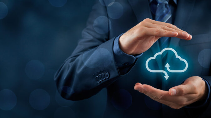 Businessman push web button Shopping Cart symbol