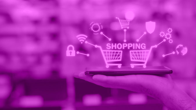 Male hand showing smartphone in electronics store. Shopping